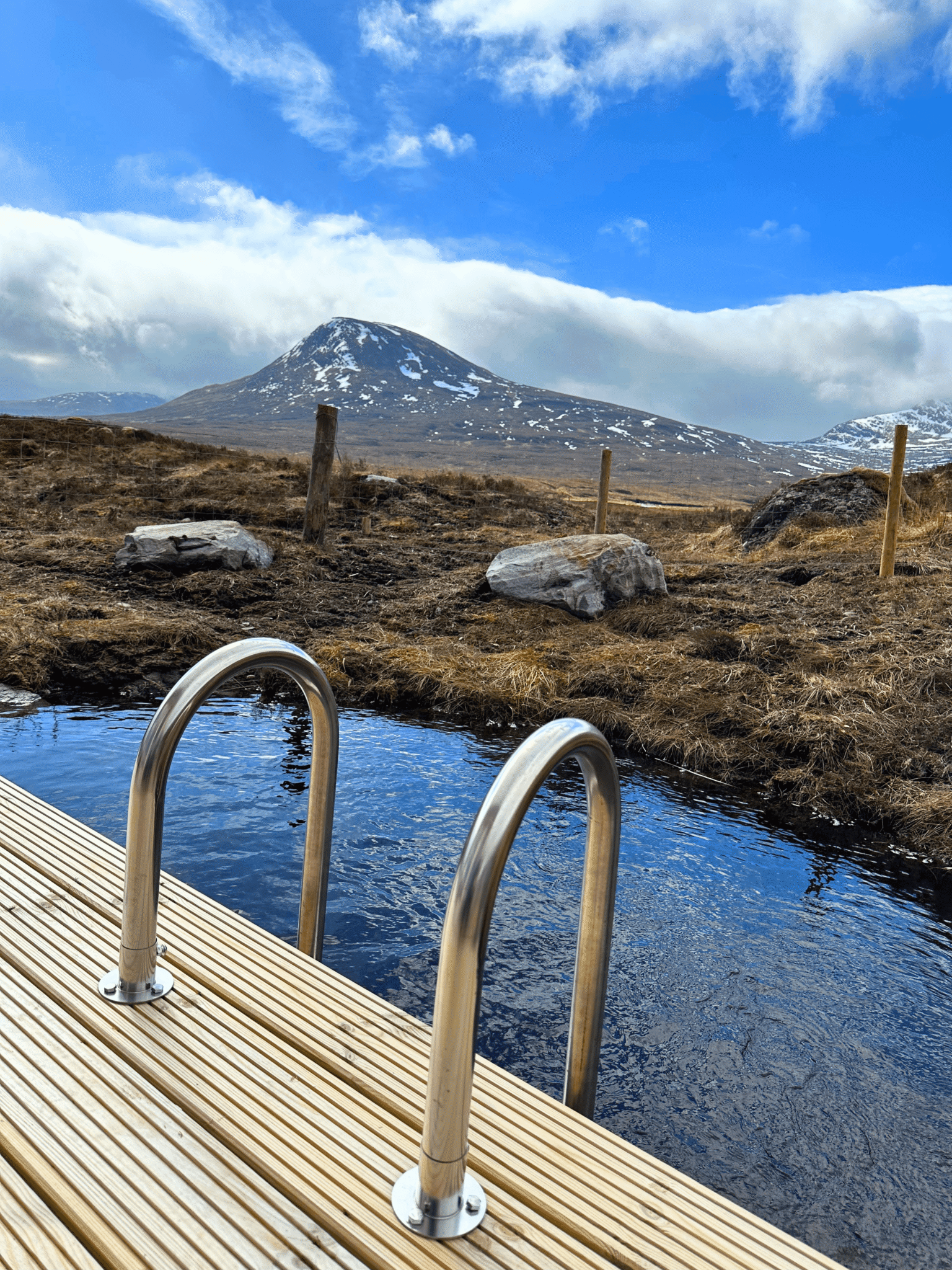 The natural plunge pool with a view of Ben Alder at Culra Lodge (Ben Alder Estate).