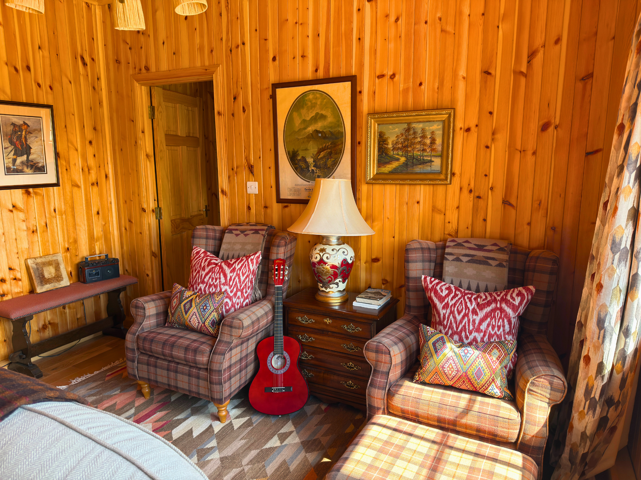 A warm seating area at the back of the open-plan living room in Culra Lodge (Ben Alder Estate).