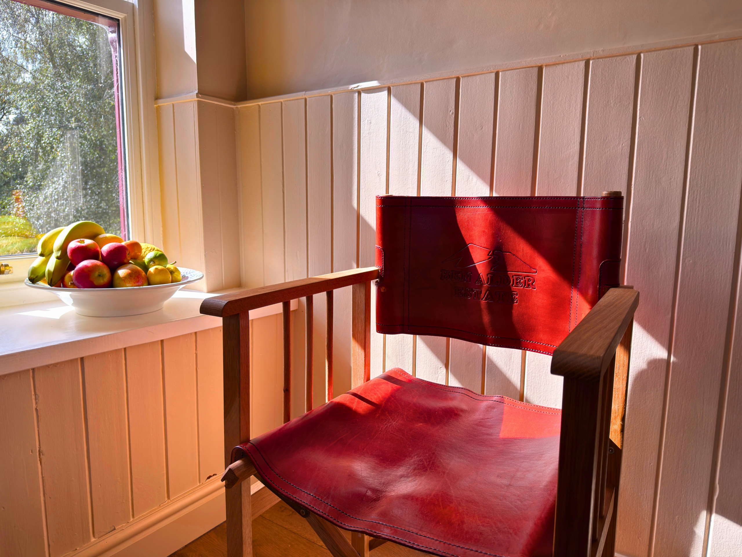 A leather chair in Strathmashie Cottage (Ben Alder Estate).